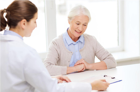 health-care professional reviewing document with participant